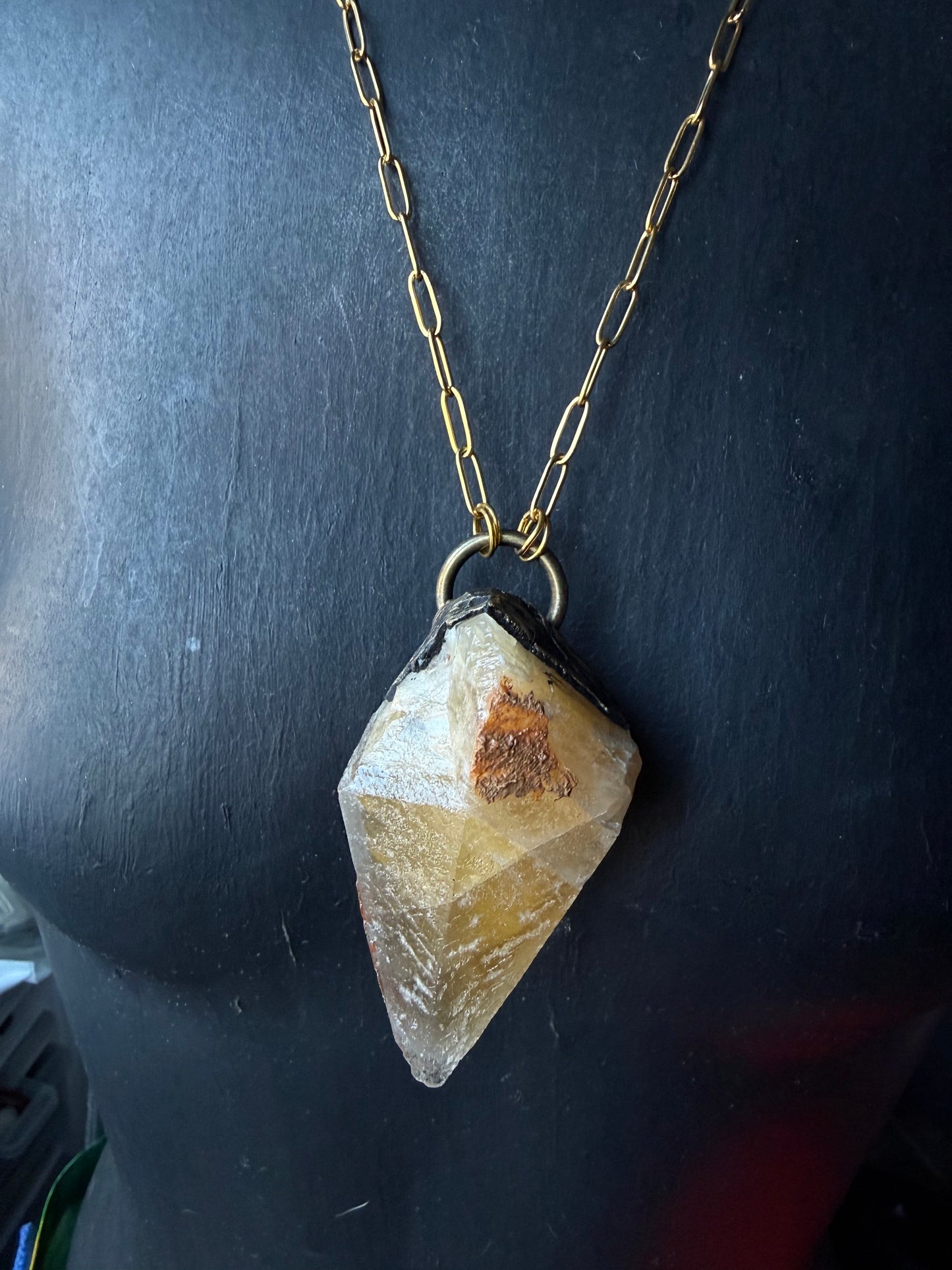 A Wolf Runner Raw Earth Pendant
