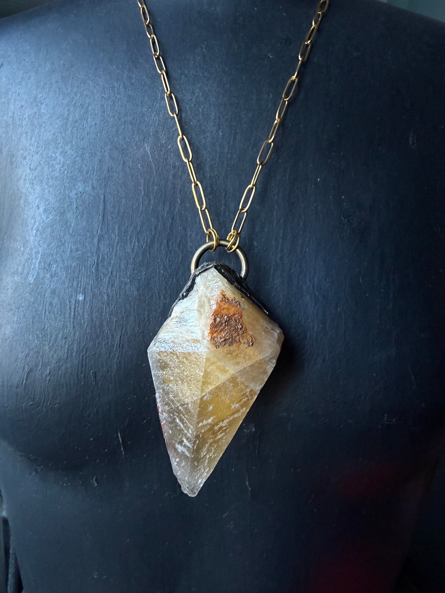 A Wolf Runner Raw Earth Pendant