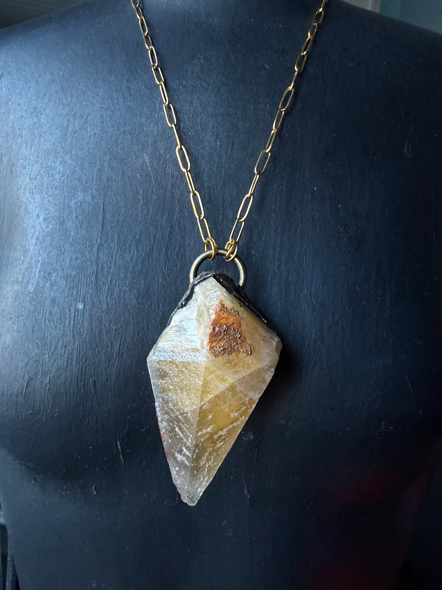 A Wolf Runner Raw Earth Pendant