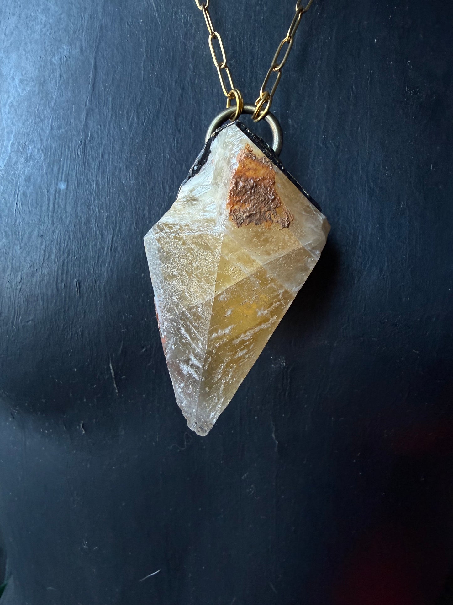 A Wolf Runner Raw Earth Pendant