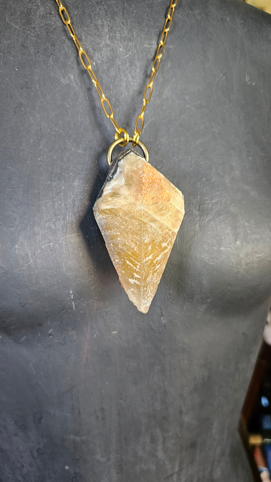 A Wolf Runner Raw Earth Pendant